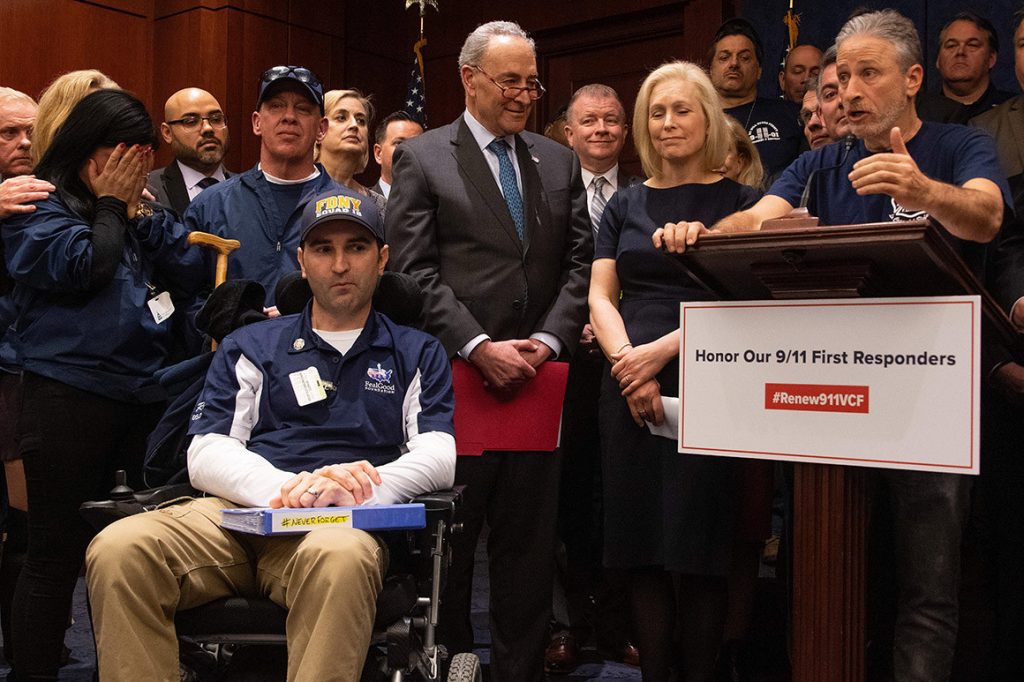 Jon Stewart appears with NY senators and 9/11 first responders, to support renewing the Victims Compensation Fund.